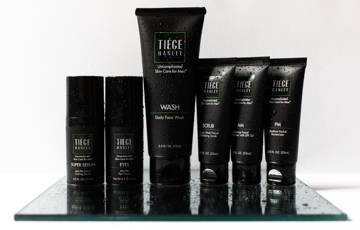 Tiege Hanley Review Skin Care Routine Products Lined Up with Water Beads