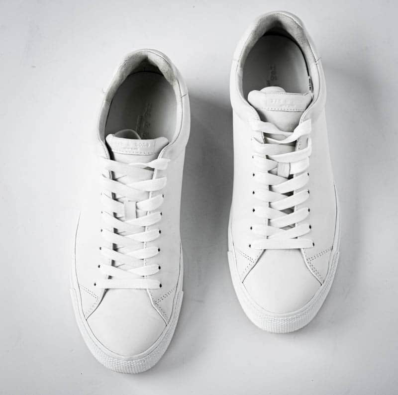 top down product image of rag and bone rb1 low white minimalist sneakers on white background