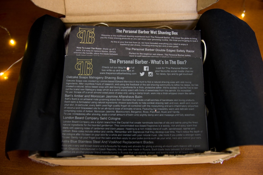 Top Down View of The Personal Barber Subscription Box Showing Instruction Booklets While Unboxing