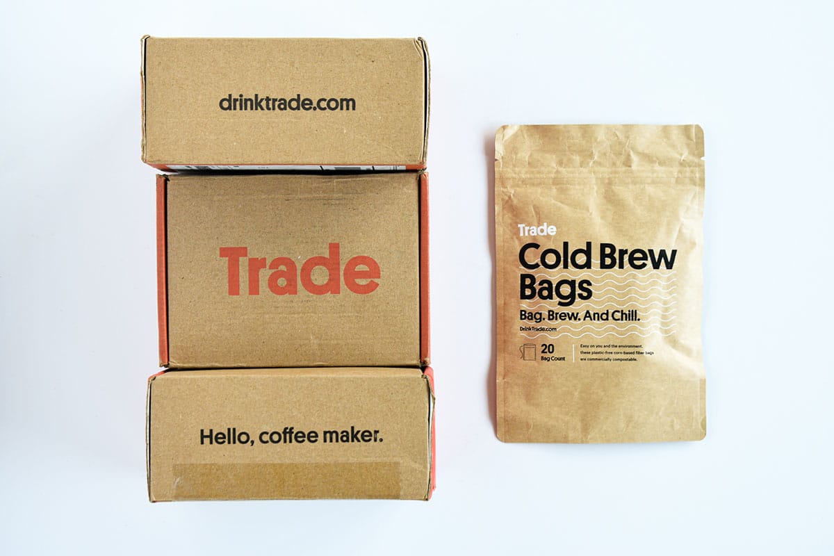 Trade Coffee Review Top Down of Box Packaging and Cold Brew Bags Bag