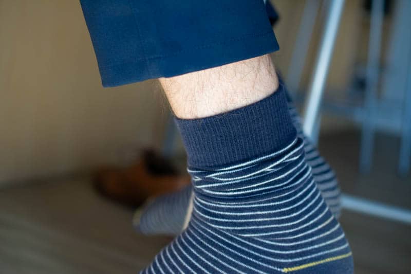 ugly sock rolled down with leg showing