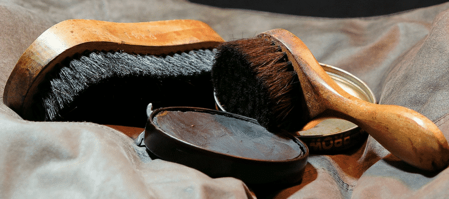 Black shoe polish with brushes