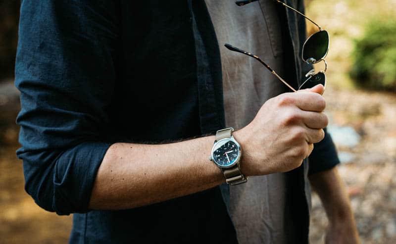 Vaer c5 field watch on model with sunglasses