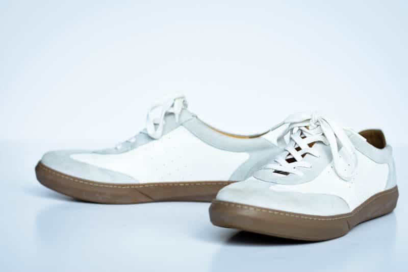 white leather brooks sneakers from moral code on white background