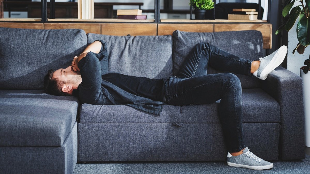 Why Is Life So Hard Stylish Man Having a Bad Day Lying on Sofa